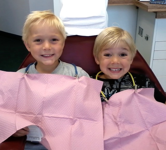 Children in dental chair at John Olson DDS during a checkup
