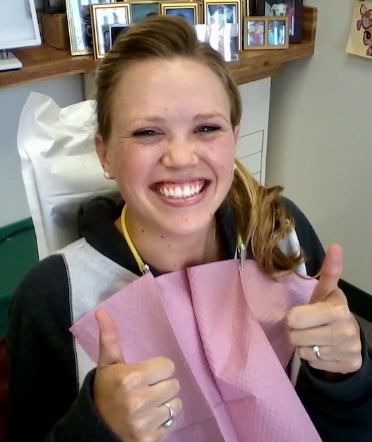 Patient smiling after orthodontic treatment at John Olson DDS Huntington Beach